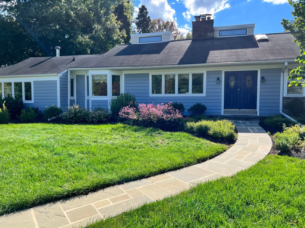 Blue home exterior after painting
