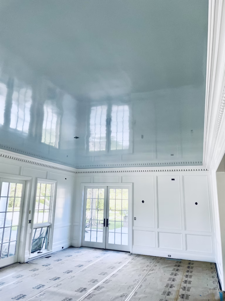 Room with floors protected during ceiling painting