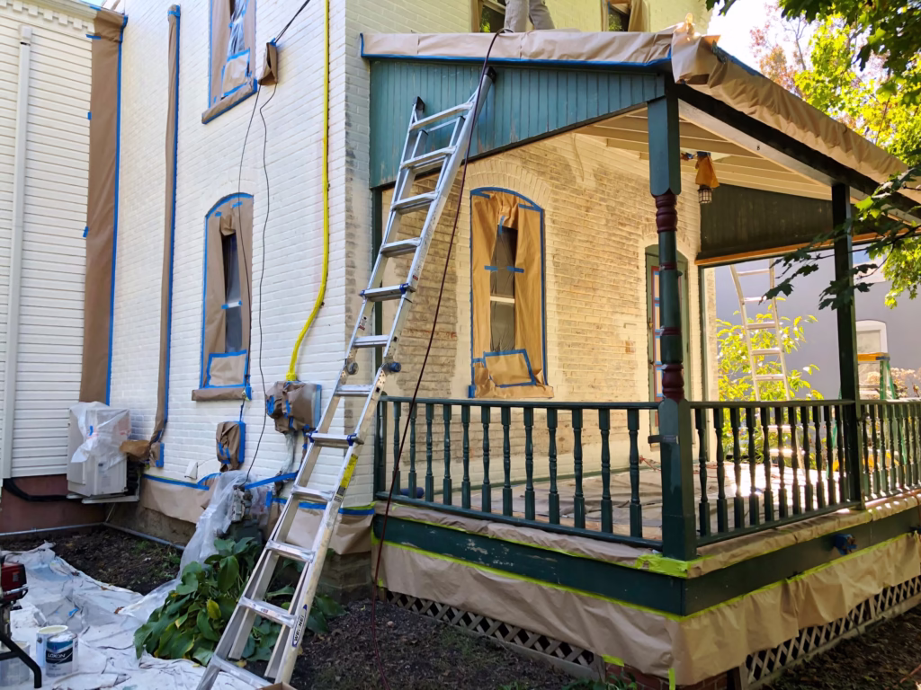 Porch masked and protected before exterior painting