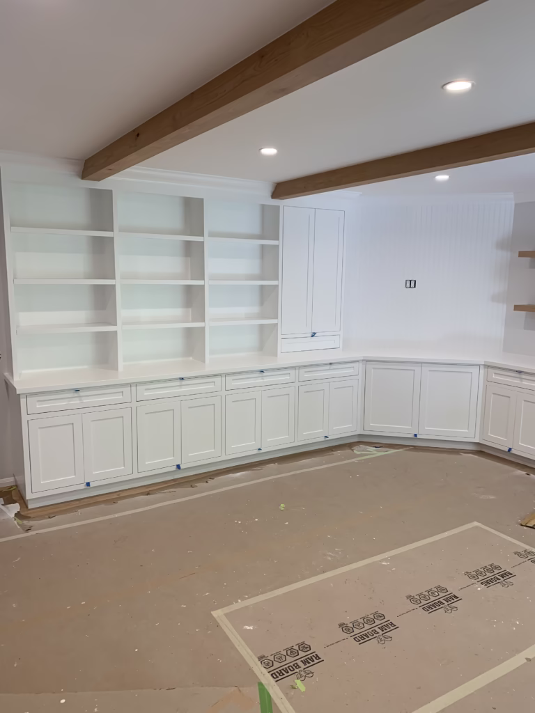 White painted built-in shelving and cabinets