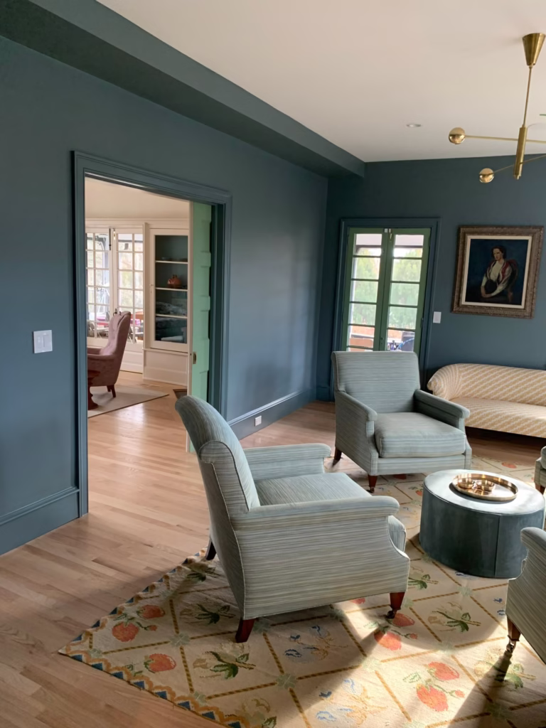 Living room painted deep teal