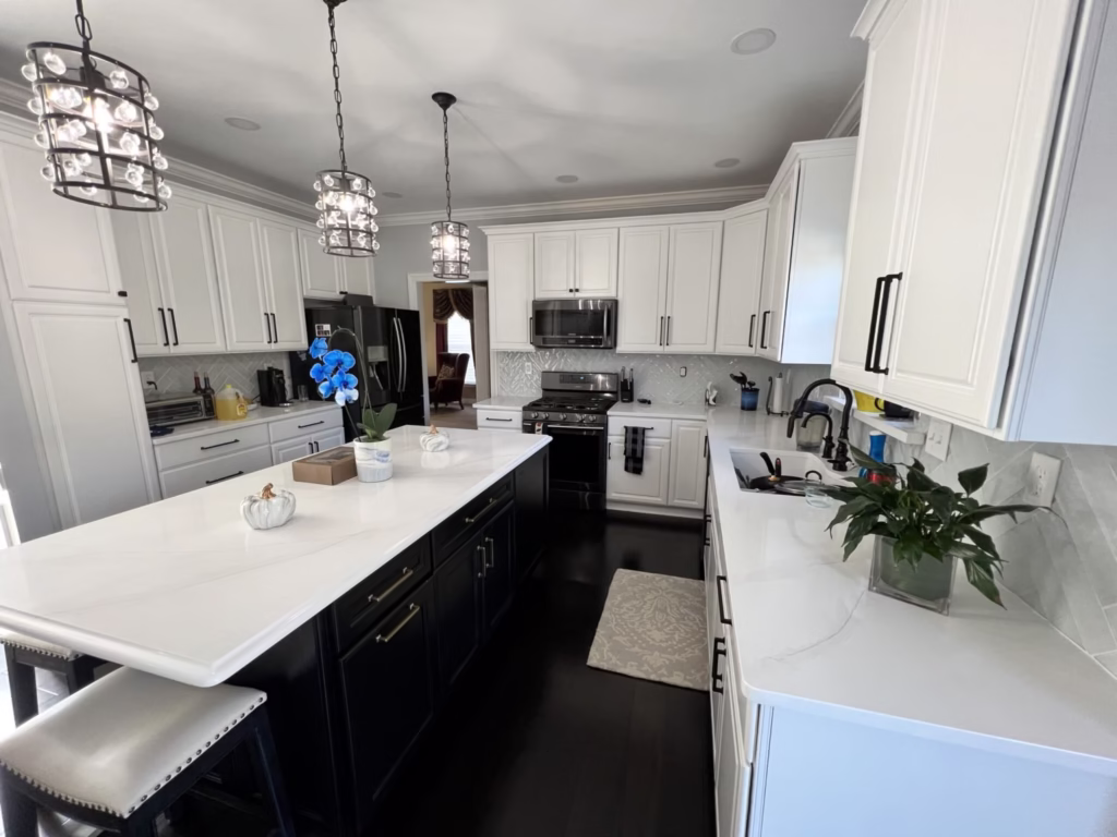 Kitchen with white and black painted cabinets