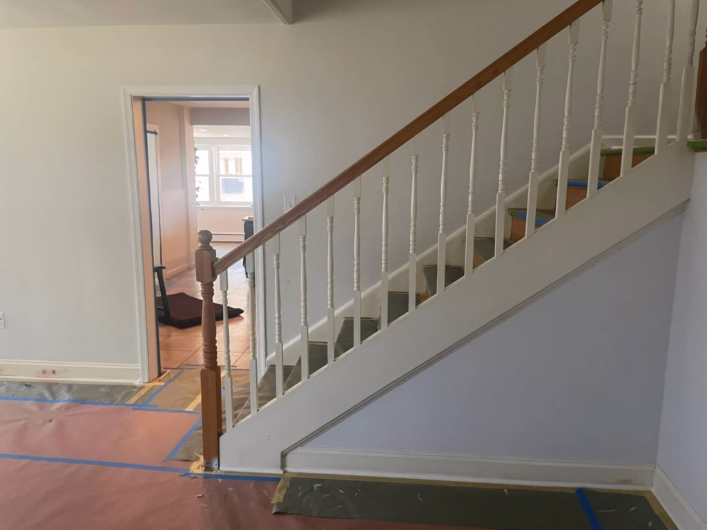 Staircase with freshly painted walls and railing