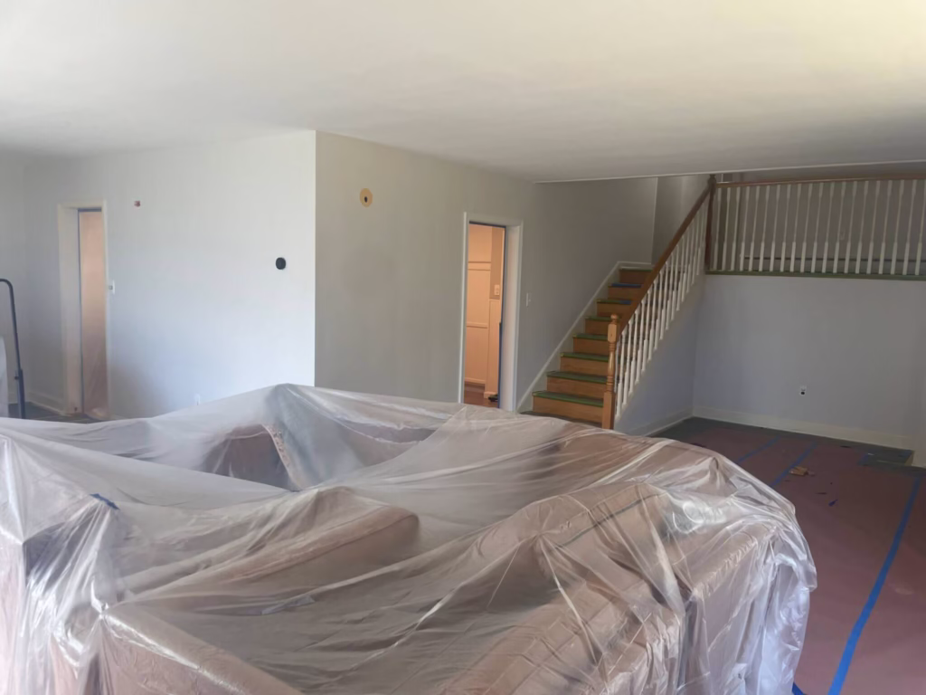 Furniture covered in plastic before interior painting